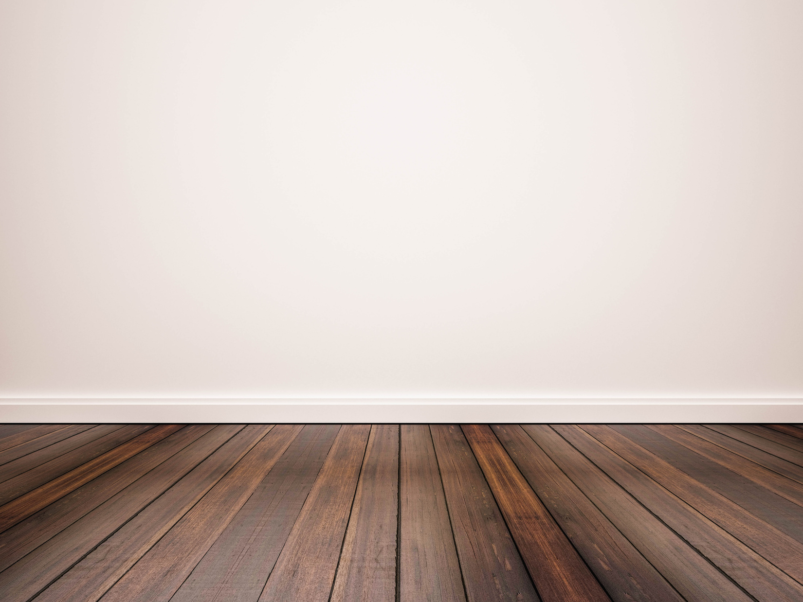 hardwood floor with white wall